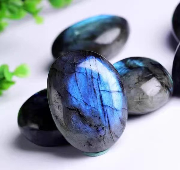 Natural gray moonstone, labradorite, stone, with the shape of the ornament crystal